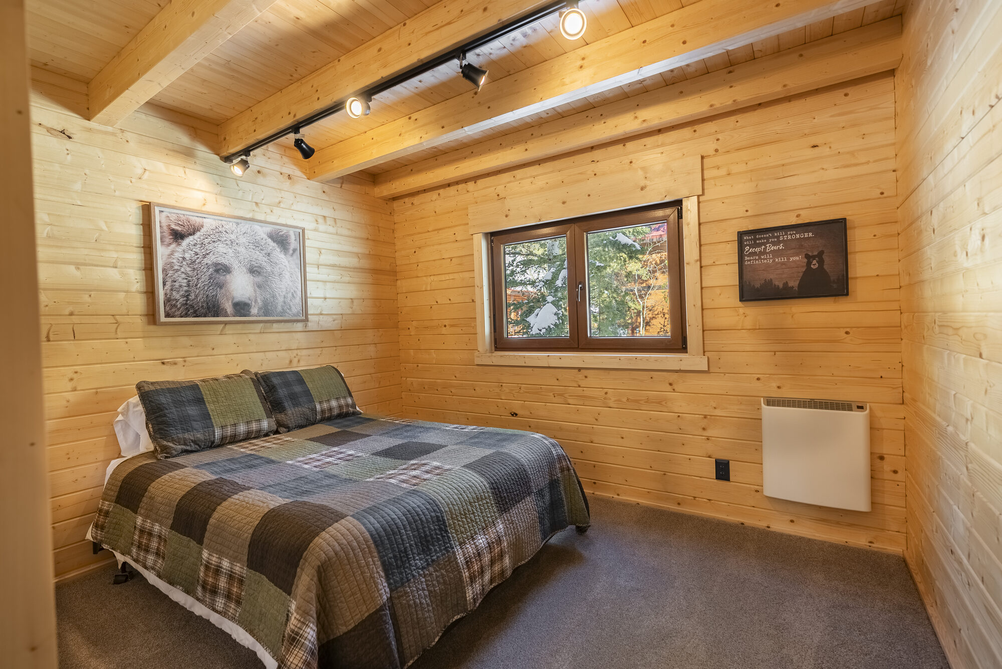 Log cabin bedroom with bear-themed decor